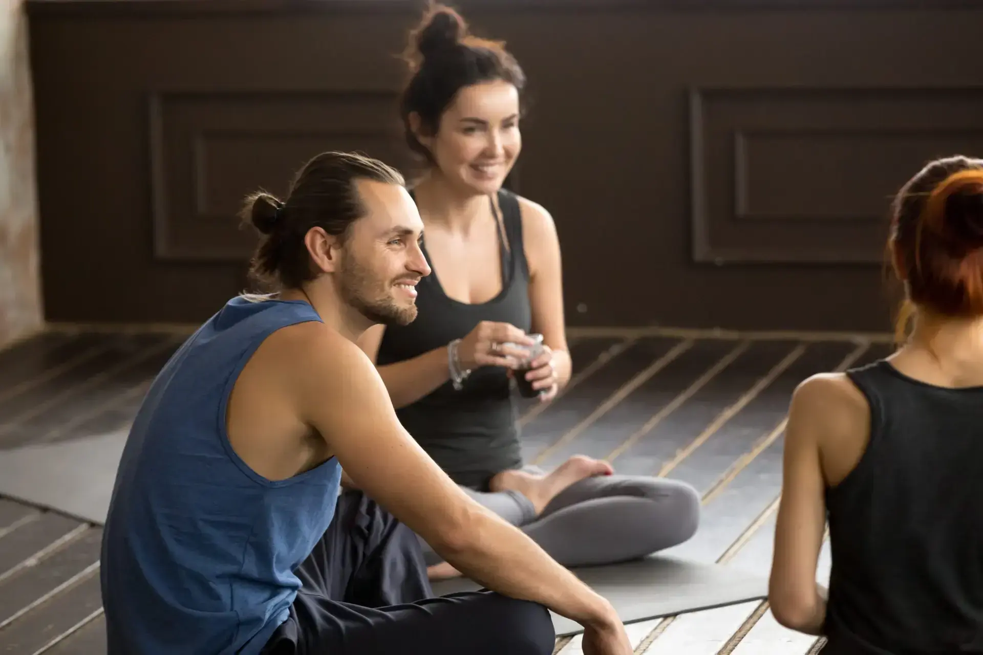 A couple talking with a facilitator.